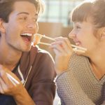 happy-couple-eating-sushi