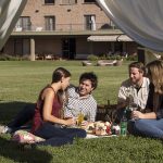 Picnic with Juan Manuel Ponce, Antonela Bailetti, Calina Salas and Nicolas Navesi in the garden at Osadia Restaurant at Dominio del Plata winery, Mendoza, Argentina